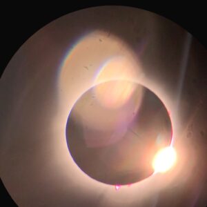 The "Diamond Ring" just at the end of totality, when the corona can still be seen all the way around the moon, but the very first peek of sunrise has appeared on the lower-right edge.